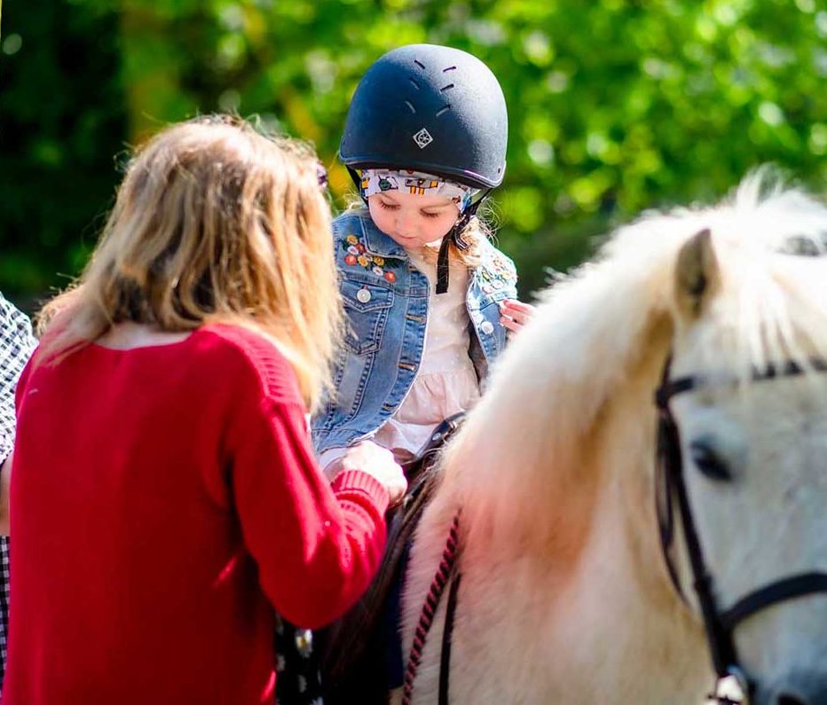 Child riding a pony at Bosinver.