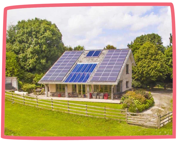 Exterior shot of Lowen cottage at Bosinver, showcasing the solar panels on top of the cottage.