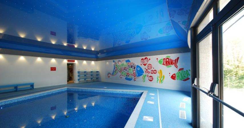 Swimming pool at Bosinver with mural on the back wall.