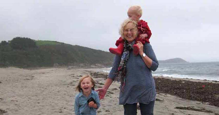 Pat with two children on a misty day at Pentewan beach in Cornwall.