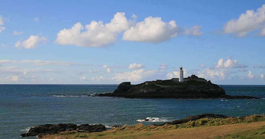 Lighthouse on a small island just off Godrevy beach in Cornwall.