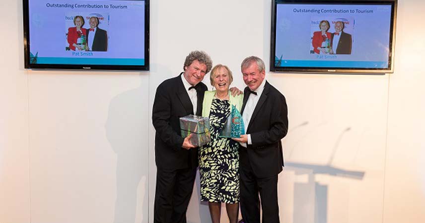 Pat and two others celebration winning an award at the Cornwall Tourism Awards in 2015.