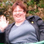 Tracey Findlow smiling and waving before her weightloss journey