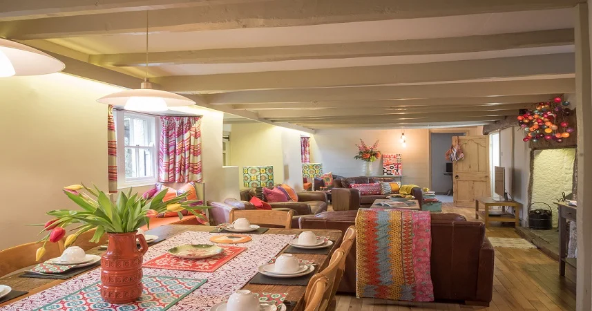 Large living room and dining area in the Farmhouse at Bosinver.