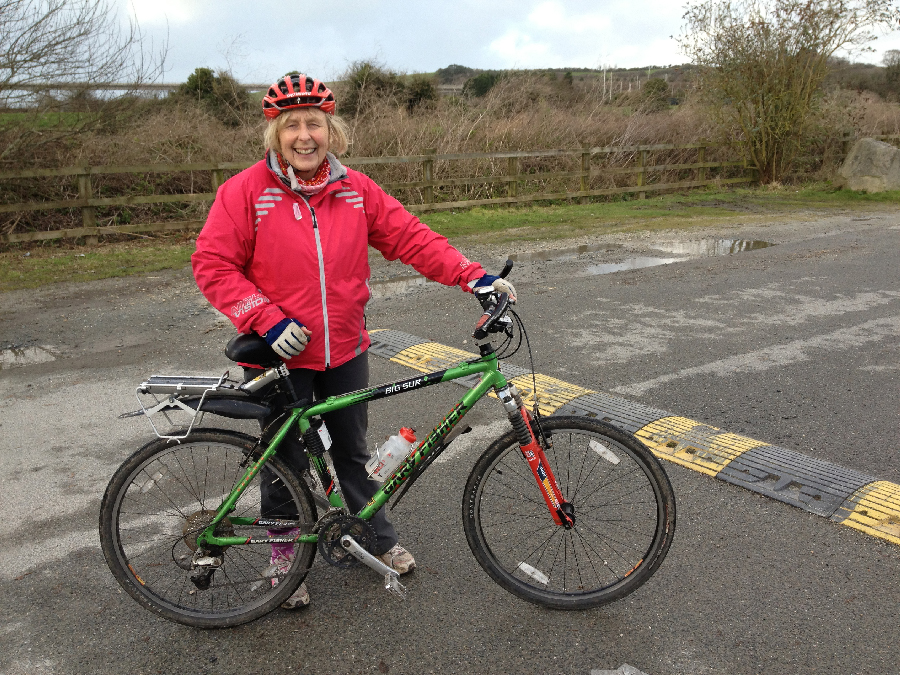 Action Nan on the Camel Trail near Padstow, Cornwall, with cycle