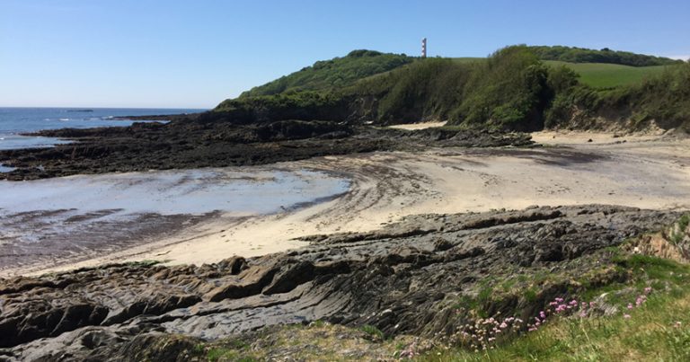 Scenic shot of the sandy beach at Polridmouth