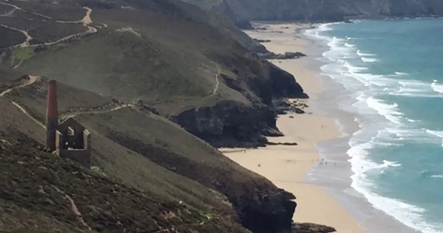 Aerial shot of St Agnes beach in Cornwall, including the remains of a tin mine.