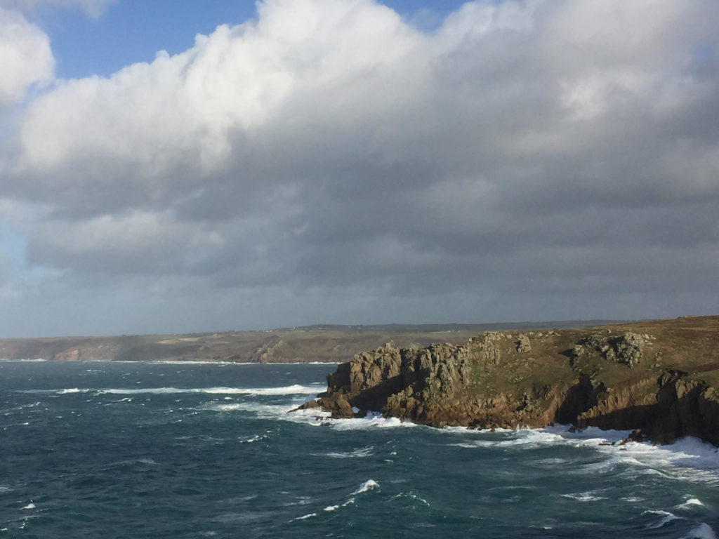 Landscape shot of the coast of Land's End on a stormy day