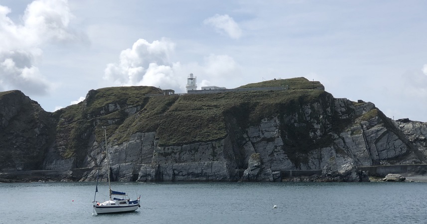Landscape of the cliffs at Lundy Island and a more boat