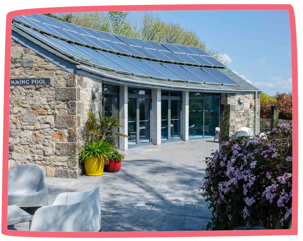 Photo of the exterior of the swimming pool building at Bosinver.