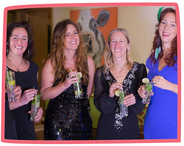 Four women smiling and drinking cocktails at Bosinver