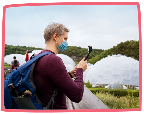 Tourist taking photos at the Eden Project with a GoPro.