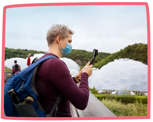 Tourist taking photos at the Eden Project with a GoPro.