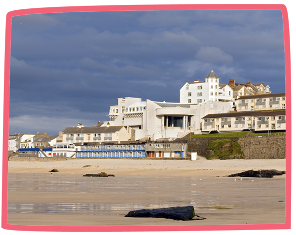 A photo of the Tate at St Ives from the perspective of the nearby beach.