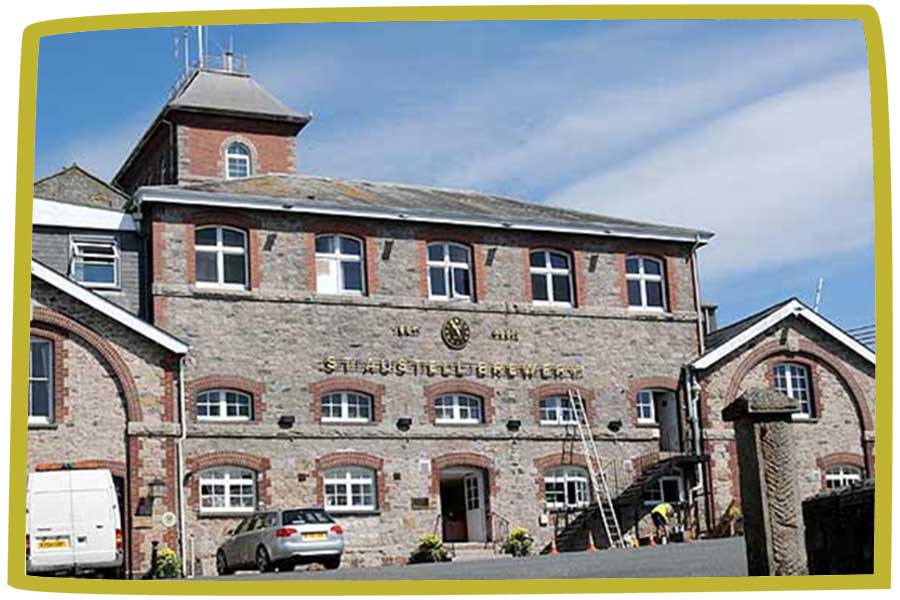 Exterior photo of St Austell Brewery in Cornwall on a sunny day.